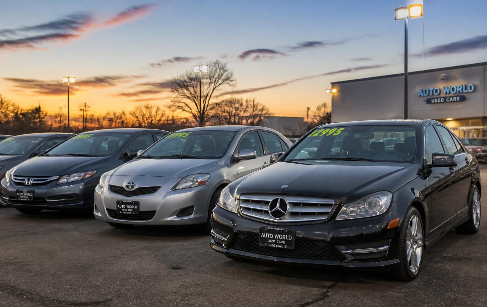 Toyota, Honda and Mercedes-Benz sedans on the dealership lot